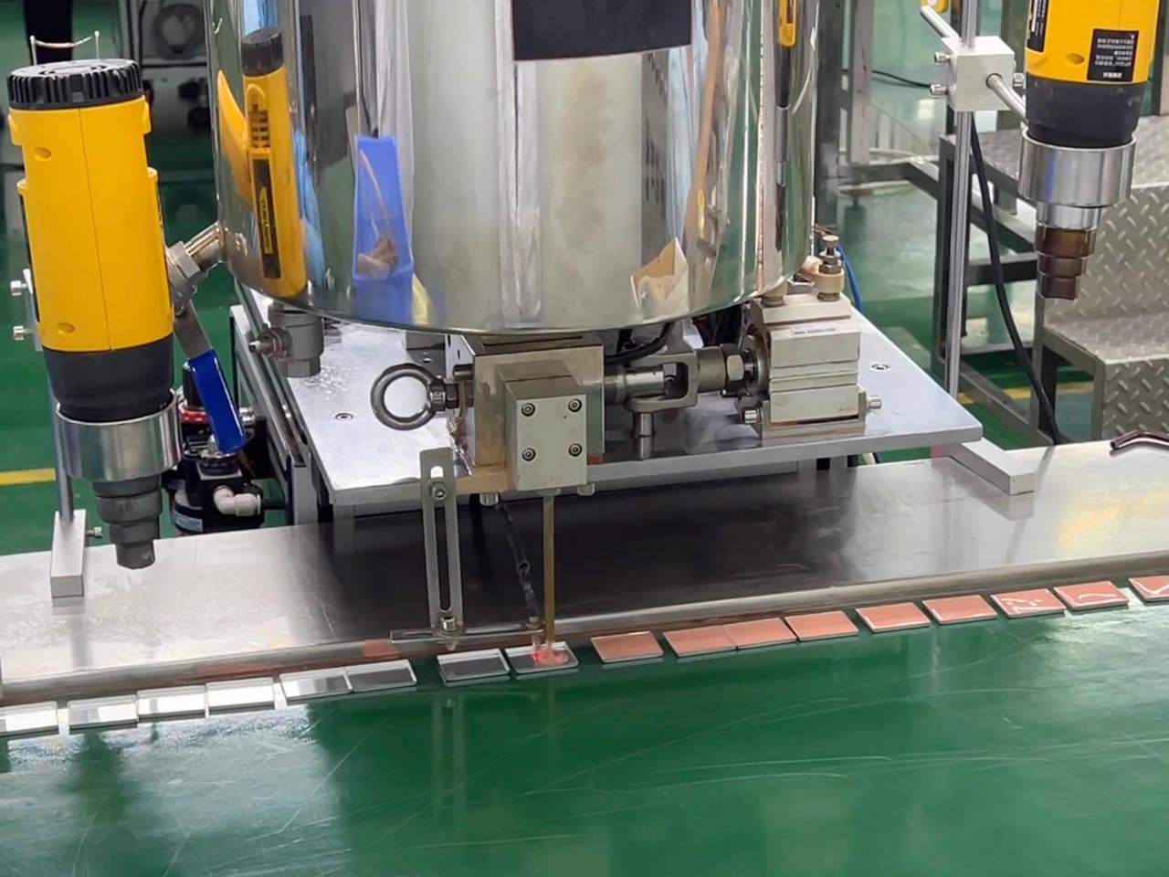 An automatic filling machine is in operation.