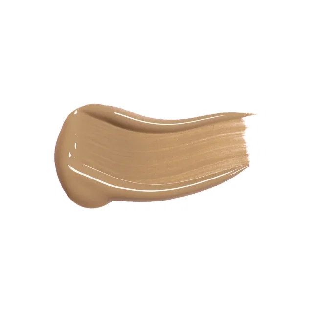 Мазок коричневого консилера на белом фоне